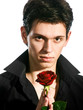 portrait  of young handsome man with red rose
