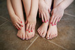 Young sisters with painted nails after a bath