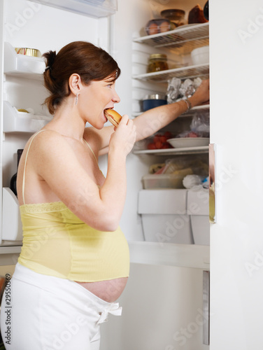 Photo: pregnant woman eating sandwich pregnant woman eating sandwich