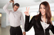 Happy businesswoman and frustrated businessman on the background