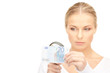 woman with magnifying glass and money