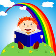 Happy child reads a book on the grass under the rainbow Happy child reads a book on the grass under the rainbow