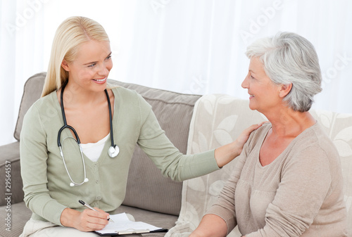 Photo: Doctor talking with her patient Doctor talking with her patient
