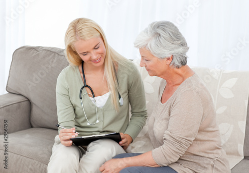 Photo: Doctor talking with her patient Doctor talking with her patient