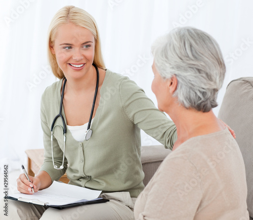 Photo: Doctor talking with her patient Doctor talking with her patient