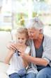 Senior knitting with her granddaughter Senior knitting with her granddaughter