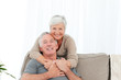 Photo: Lovers hugging while they are looking at the camera Lovers hugging while they are looking at the camera