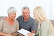 Photo: Seniors with doctor at home Seniors with doctor at home