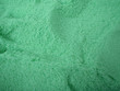 large amount of Green bath salt with scoop holes in it