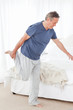 Mature man stretching