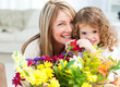 Young girl with her grandmother looking at the camera Young girl with her grandmother looking at the camera