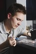 Man Working On A Crossword