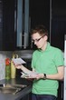 A Man Reading Envelope In The Kitchen