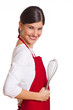 Frau mit Schneebesen in der Hand
