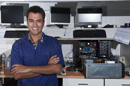 Photo : small business owner of a computer repair store small business owner of a computer repair store