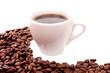 Small white cup of coffee with coffee grain on grain background