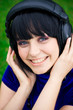 pretty young smiling woman listening music