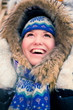 Happy young woman plays with a snow
