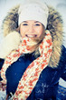 Happy young woman plays with a snow