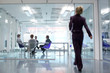 Photo: Businesswoman walking towards conference room Businesswoman walking towards conference room
