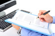 Businessman is checking a paperwork and making notes Businessman is checking a paperwork and making notes