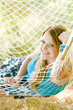portrait of woman resting in hammock