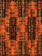 Macro detail of handwoven fabric with orange pattern