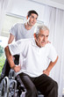 Young nurse helping senior man