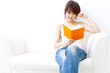 a portrait of beautiful asian woman leading a book