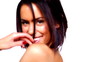 Excited sexy young woman posing against white background