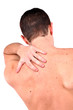 young caucasian man with pain in a back isolated on white