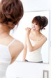 a portrait of beautiful asian woman brushing teeth
