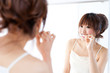 a portrait of beautiful asian woman brushing of teeth