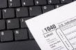 Laptop with a form 1040 Laptop with a form 1040