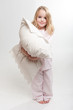 Foto: Little girl holding a pillow Little girl holding a pillow