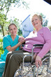 Nurse holding senior patient's hand