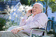 Man in a wheelchair on a phone