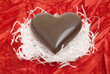 chocolate heart on red background