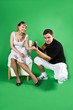 A man and girl isolated on green A man and girl isolated on green
