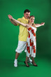 A man and girl isolated on green A man and girl isolated on green