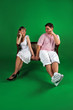 A man and girl isolated on green A man and girl isolated on green