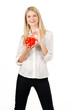 Blonde smilling woman with red piggy savings box