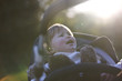 A baby girl crying in her buggy