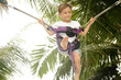 young boy jumping bungee