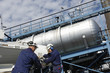 giant oil pump and workers