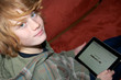 Young boy surfing the internet with a tablet computer