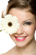 Photo: young girl with white gerber in front of her head young girl with white gerber in front of her head