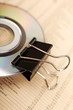 Close photo of paperclip attached to disk. Close photo of paperclip attached to disk.