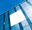transparent glass wall with blank placard of skyscraper