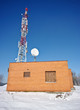 Winter view with transmitter and red brick house